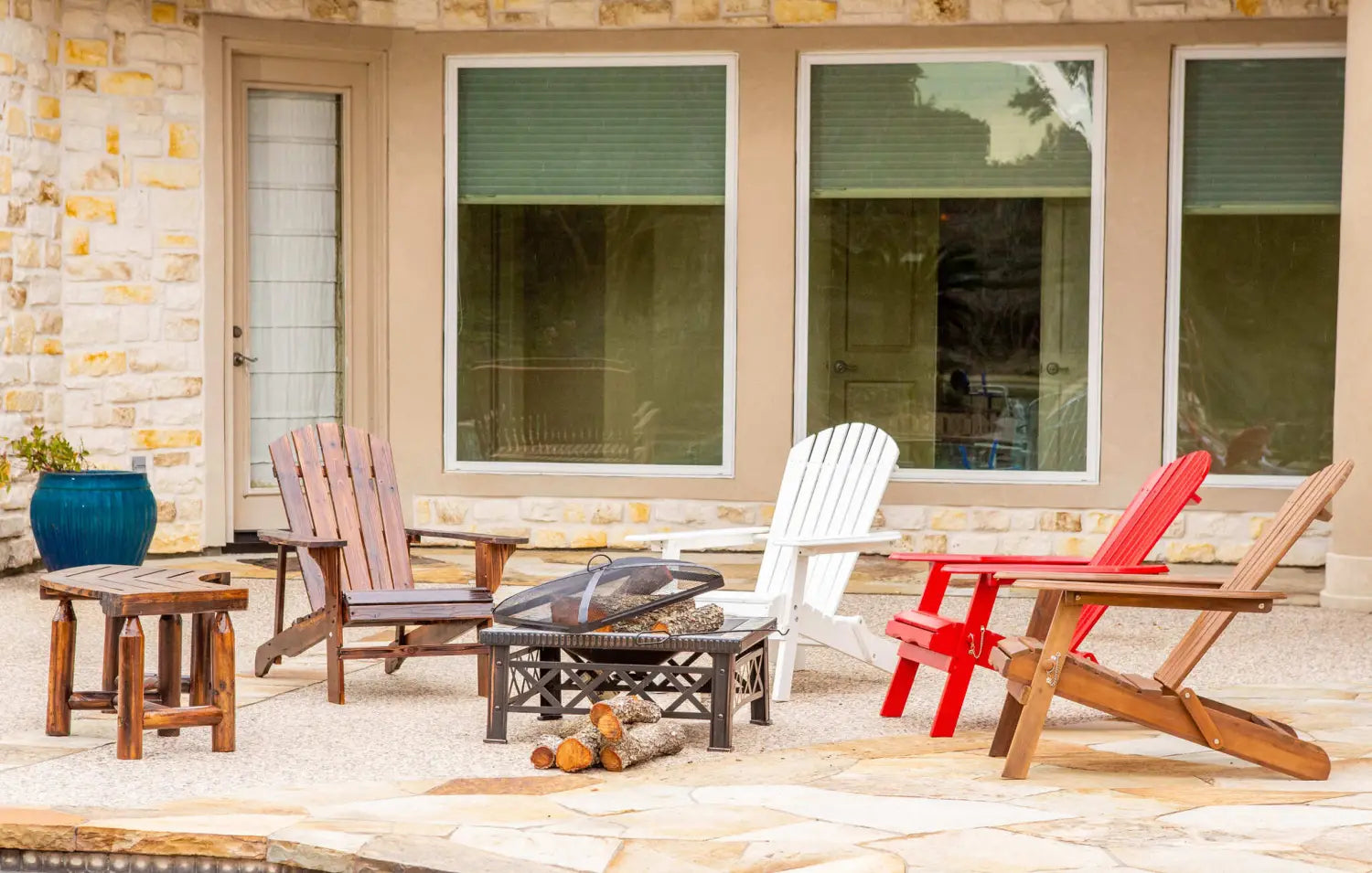 Fire Pit surrounded by chairs poolside